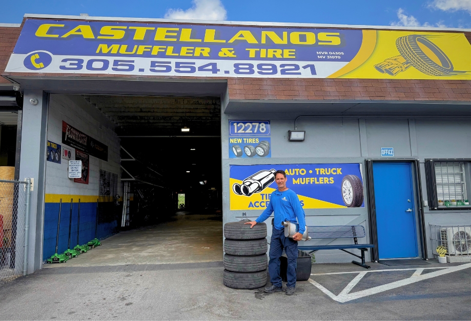 Ernie from Castellanos Muffler & Tire at the entrance of his shop